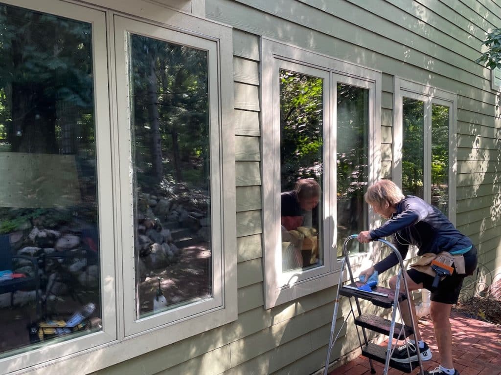 applying bird safety window film to a home