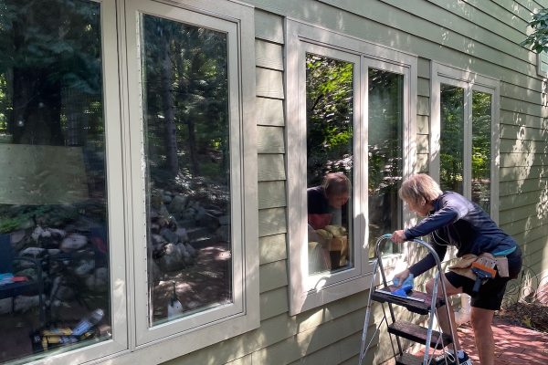 applying bird safety window film to a home